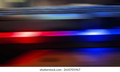 Abstract horizontal motion blur of red and blue light trails creates a speed effect suggesting dynamic movement.