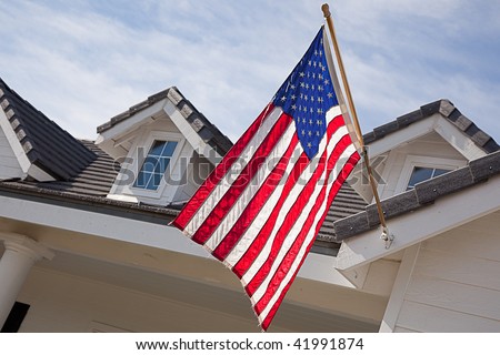 Abstract House Facade & American Flag Against a Blue Sky