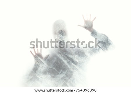 abstract human figure behind glass