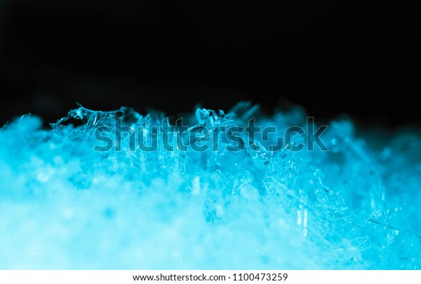 Abstract ice crystal structure texture,\
macro view. Cold concept, blue and black\
colors.