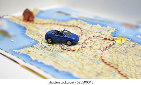 Abstract Idea Of Rent A Car. Small Car On Map.