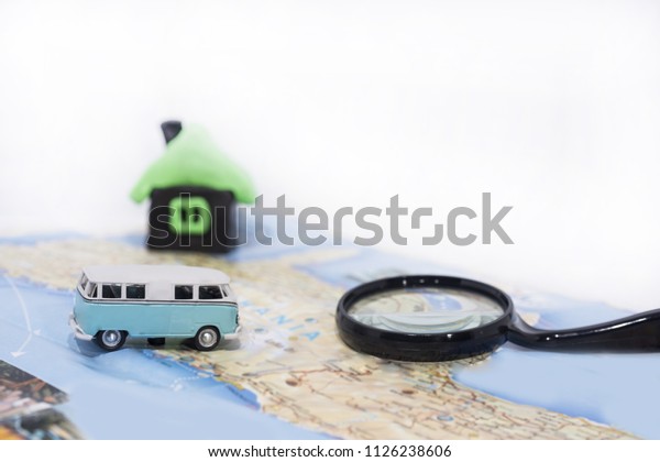 Abstract idea of rent a car. Small car on map.\
Abstract travel photo.