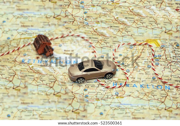 Abstract idea of\
rent a car. Small car on\
map.