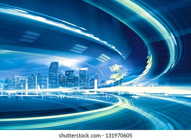 Abstract Illustration Of An Urban Highway Going To The Modern City Downtown, Speed Motion With Colorful Light Trails.