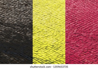 Abstract image of a Belgian flag blended with a real cobblestone road pattern. Image related to the famous French road cycling races on the cobblestone roads (Tour of Flandres). - Powered by Shutterstock