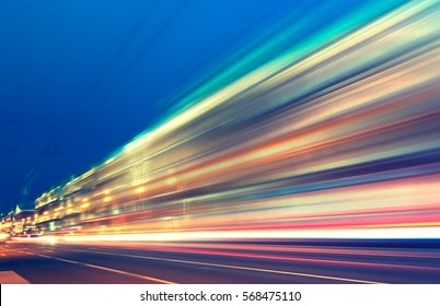 abstract image of blur motion of cars on the city road at night - Shutterstock ID 568475110