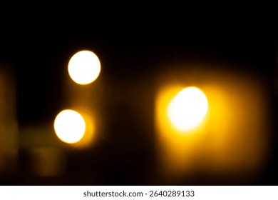 Abstract image of bright, out-of-focus circular lights creating a warm, glowing bokeh effect against a dark background, suitable for backgrounds. - Powered by Shutterstock - Get 15% off with code: PIKWIZARD15