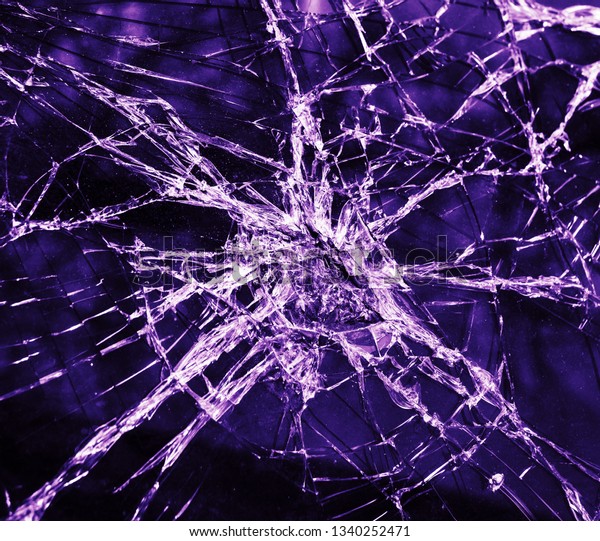 Abstract image of broken glass\
texture. Close-up broken car windshield. Broken and damaged\
car