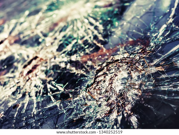 Abstract image of broken glass
texture. Close-up broken car windshield. Broken and damaged
car