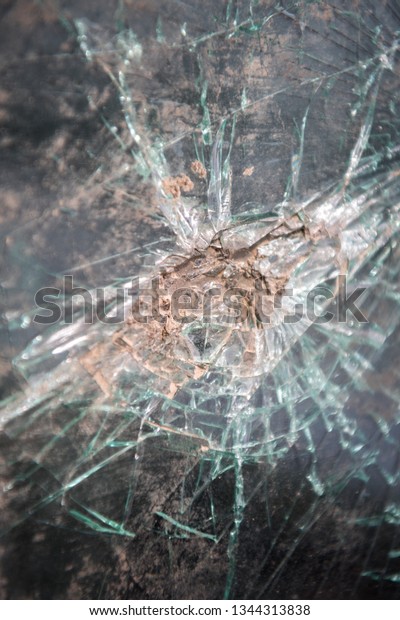 Abstract image of\
broken glass texture, background. Close-up broken car windshield.\
Broken and damaged car