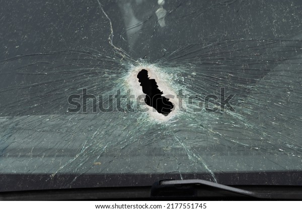 Abstract image of\
broken glass texture, background. Close-up of a broken car\
windshield. Broken and damaged\
car.