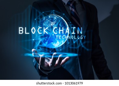 The abstract image of the business man hold the blockchain hologram on hand and element of this image furnished by Nasa. the concept of cryptocurrency, blockchain, internet of things and future life