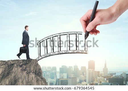 Abstract image of businessman with briefcase crossing abstract bridge drawn by hand on city background. Help concept