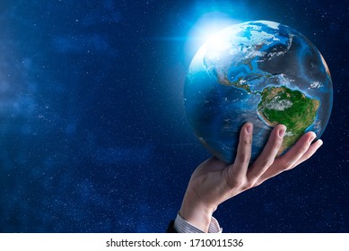 The abstract image of the businessman holds the marble earth on hand and element of this image furnished by Nasa. the concept of communication network, internet of things and future life