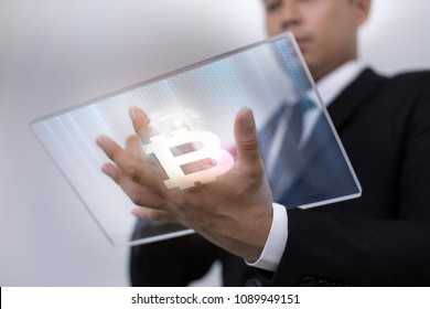 Abstract Image of Businessman touch the Bitcoin and digital hologram. Future Business Bitcoin and technology Concept. - Shutterstock ID 1089949151