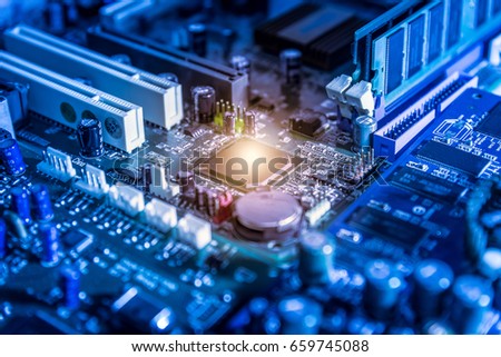 The abstract image of the chipset on the computer mainboard. The concept of computer hardware upgrade and technology