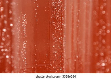 Abstract Image Of Clear Wet Shower Curtain With Tiles In Background