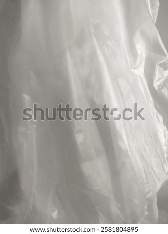 Abstract image of crumpled, translucent plastic sheet.