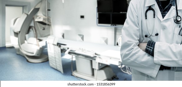 Abstract image of doctor in a white coat with a statostcope on the background of an angiograph in a modern hospital for heart surgery. Panorama.