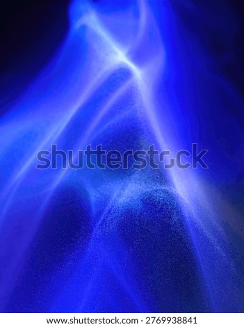 An abstract image featuring swirling patterns of bright blue light against a dark background, creating a sense of energy and movement.