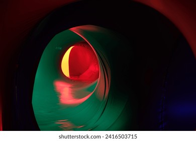 Abstract image featuring vibrant illuminate red, blue, pink, and green lights, creating a colorful and dynamic abstract display. Perfect for a modern and electric-themed background in nightlife 