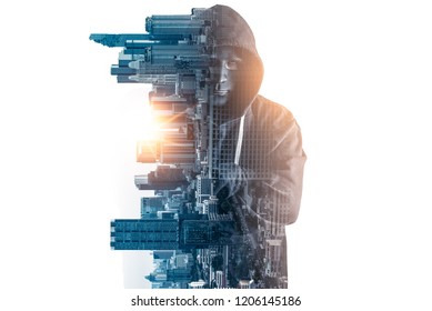 The abstract image of the hacker standing overlay with futuristic hologram and the future cityscape is backdrop. the concept of cyber attack, virus, malware, illegally and cyber security.