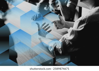 Abstract image of hands gesturing over a table with blue geometric shapes overlay. Discussion, hands, and geometric shapes create a dynamic visual. Business image.