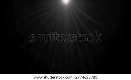 An abstract image of light emanating from a central point, creating a dramatic visual effect against a dark background, suitable for conceptual themes.