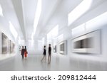 abstract image of people in the lobby of a modern art center with a blurred background