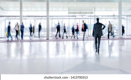 Abstract Image Of People In The Lobby Of A Modern Business Center With A Blurred Background