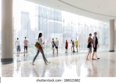 Abstract Image Of People In The Lobby Of A Modern Business Center With A Blurred Background