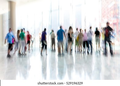 Abstract Image Of People In The Lobby Of A Modern Business Center With A Blurred Background