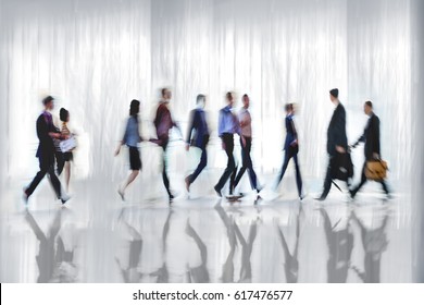 abstract image of people in the lobby of a modern business center with a blurred background