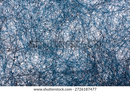 Abstract image of a plurality of intertwined threads
