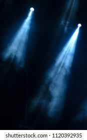 abstract image with rays of colored light in the dark