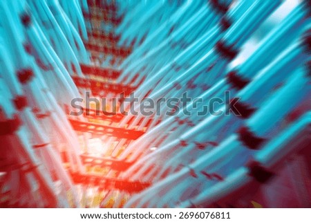 Abstract image showcasing vibrant network cables in dynamic blue hues, emphasizing technology and connectivity in a visually striking arrangement.