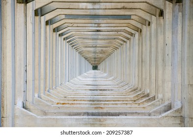 Abstract Image Of Support Beams Under An Old Aqua-duct Creating A Unique Ongoing Repetitive Design Into The Distance