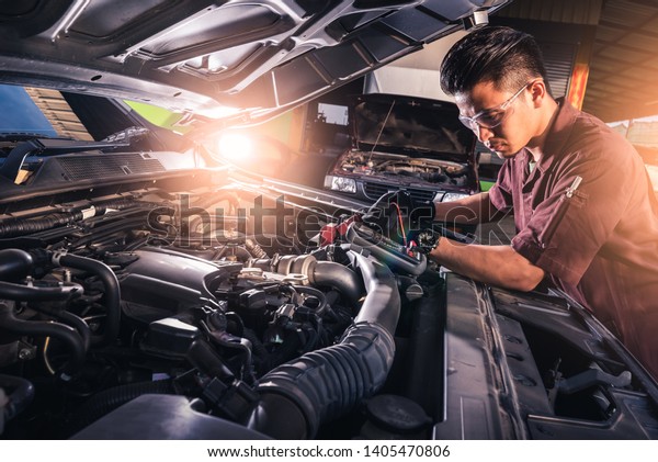 The abstract image of
the technician using voltage meter for voltage measurement a car's
battery. the concept of automotive, repairing, mechanical, vehicle
and technology.