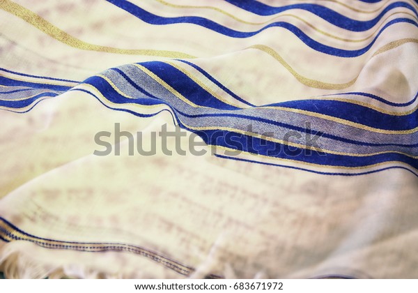 Abstract image of white Prayer\
Shawl - Tallit, jewish religious symbol. Double exposure\
concept.