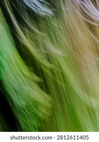 Abstract intentional camera movement motion blur green and gold background
