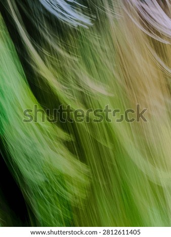 Abstract intentional camera movement motion blur green and gold background