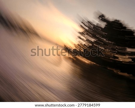 Abstract intentional camera movement of a sunset landscape with warm blurred motion textures