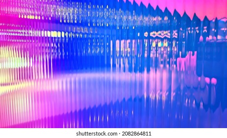 abstract iridescent polycarbonate texture background. close up view. holographic foil on polycarbonate. real modern trendy colorful wall background.