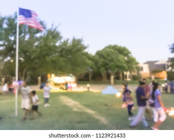 Abstract Kids Having Fun With Sparkler Fireworks And Glow At July 4th Celebration Event In Irving, Texas, USA. Diverse Group Of Local Residents Crowd Celebrate Fourth Of July At Evening