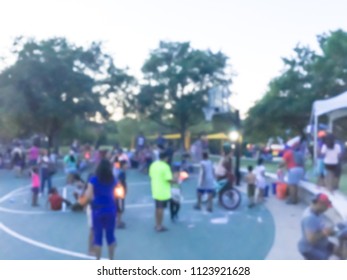 Abstract Kids Having Fun With Sparkler Fireworks And Glow At July 4th Celebration Event In Irving, Texas, USA. Diverse Group Of Local Residents Crowd Celebrate Fourth Of July At Evening