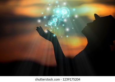 Abstract lamp science with question marks in hand on sunset background / soft focus image Vintage concept
