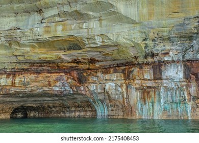 Abstract landscape of a mineral stained cliff along the eroded sandstone shoreline of Lake Superior, Pictured Rocks National Lakeshore, Michigan’s Upper Peninsula, USA