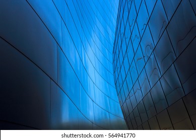Abstract leading lines on blue converging in center forming circular shape.