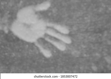 An Abstract Of A Left Human Hand, Showing The Universal Left Handshake Gesture Of Disrespect To One And All, With A Complete Coverage Of Grey Circular Bokeh.