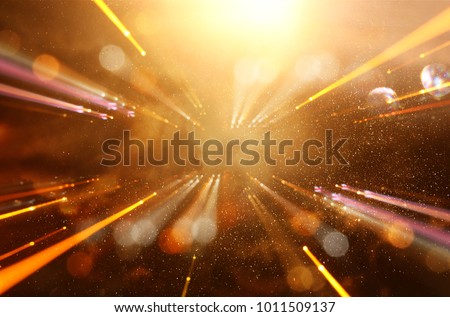 Abstract lens flare. concept image of space or time travel background over dark colors and bright lights